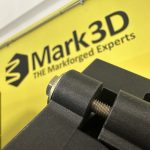 A 3D printed CNC machining fixture with fully embedded nuts, created using the pause and insert method with a Markforged 3D printer