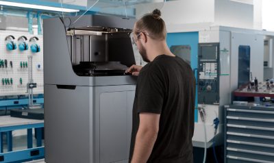 3D printing operator on machine shop floor